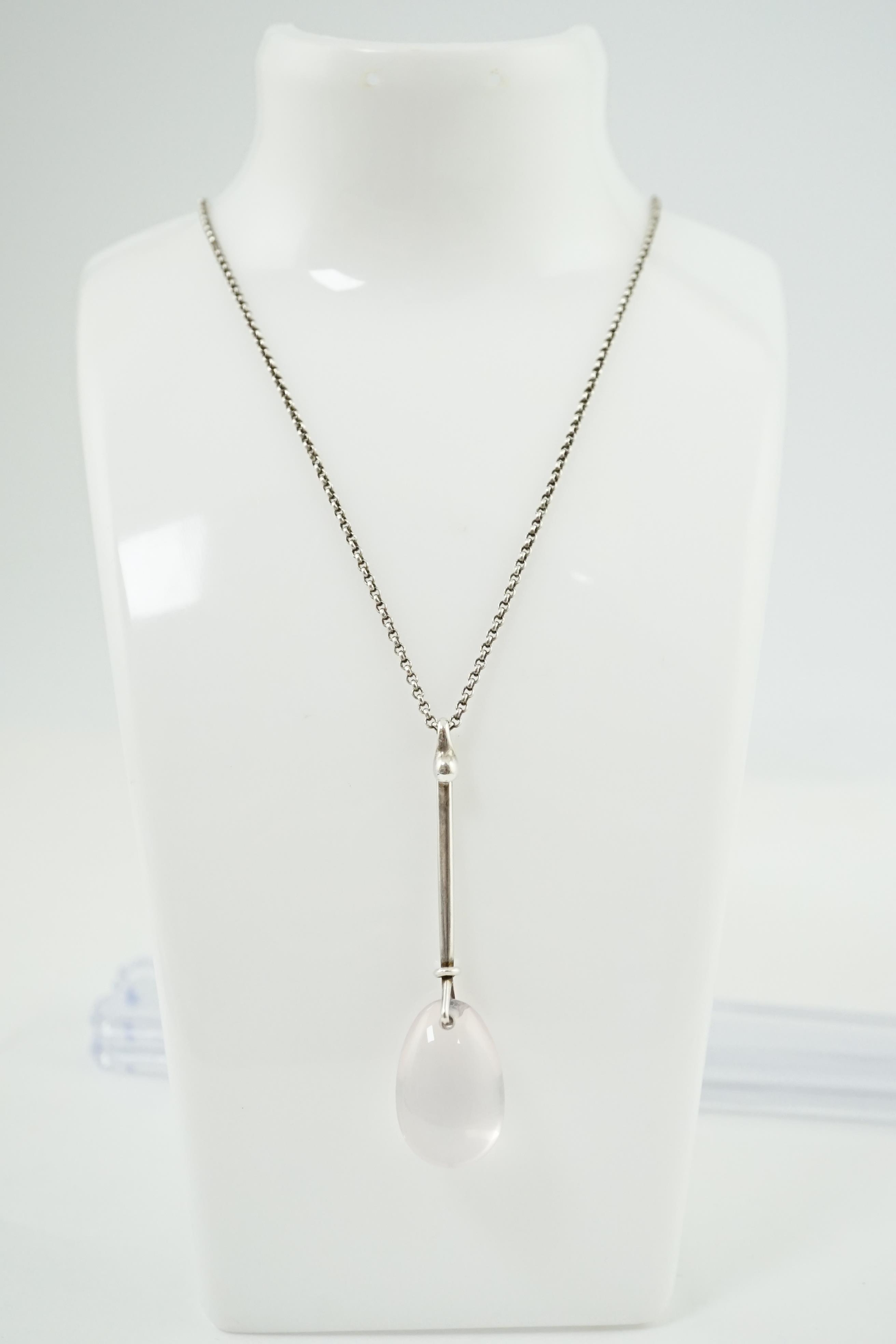 A Vivianna Torun Bülow-Hübe for Georg Jensen sterling silver and rose quartz set drop pendant, on a Georg Jensen sterling silver chain, pendant design no.128, 65mm, chain 66cm. Condition - good